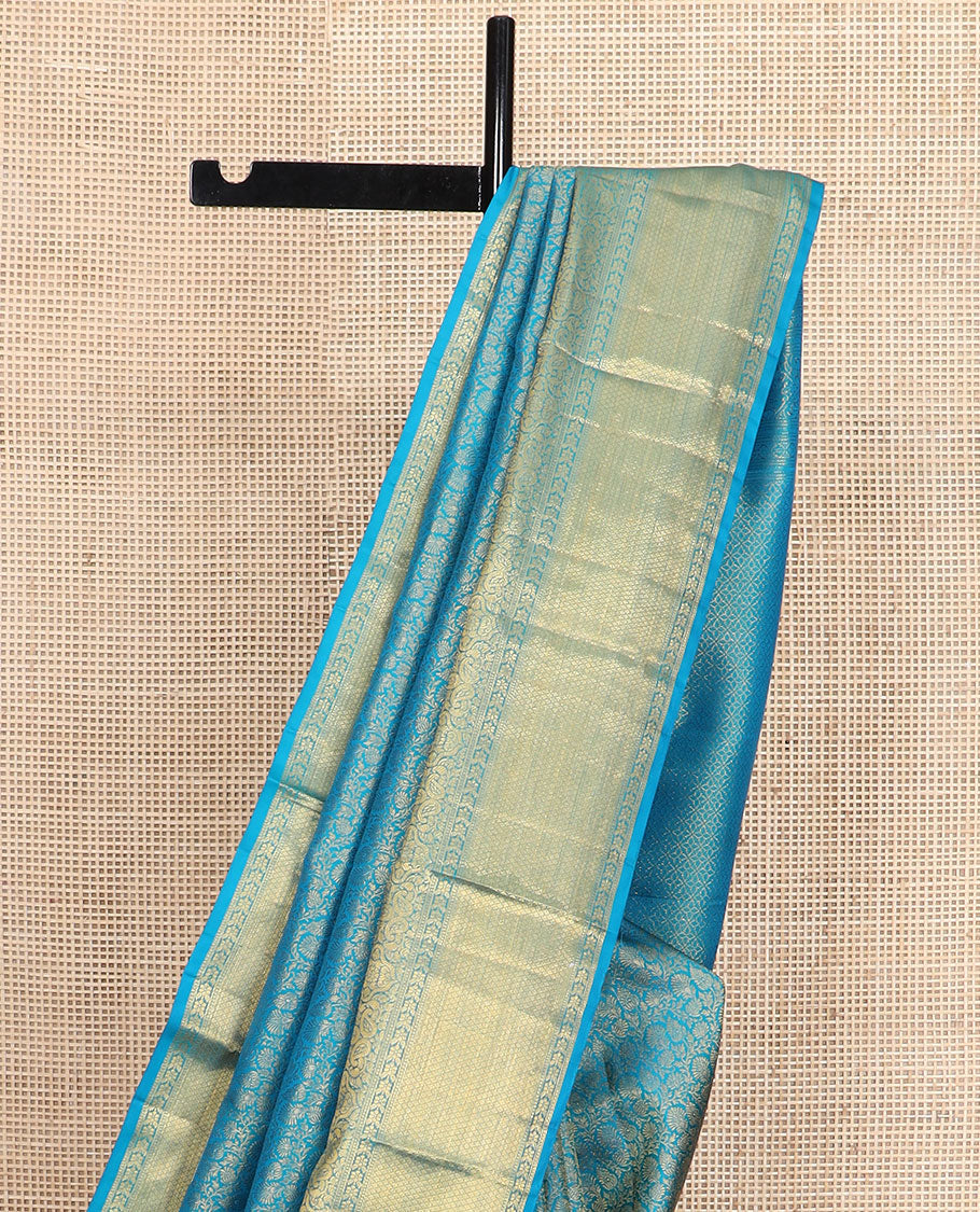 Blue floral jacquard Kanchipuram wedding silk saree, zari border of floral, manga, and mayil kann designs, and jaal pallu