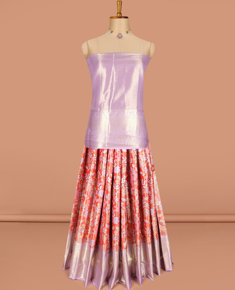 Bright red art silk half-saree pavadai material, floral jacquard with contrast traditional border skirt, jacquard blouse, and zari design dhavani