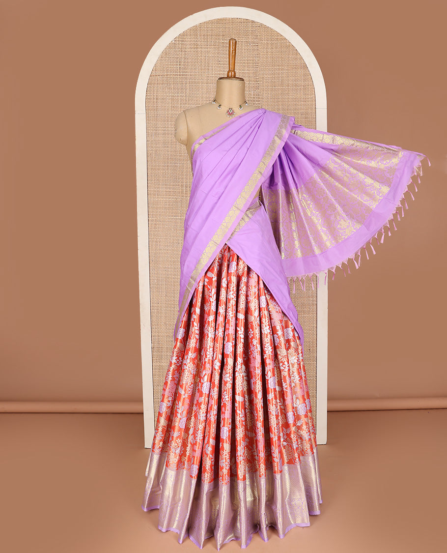 Bright red art silk half-saree pavadai material, floral jacquard with contrast traditional border skirt, jacquard blouse, and zari design dhavani