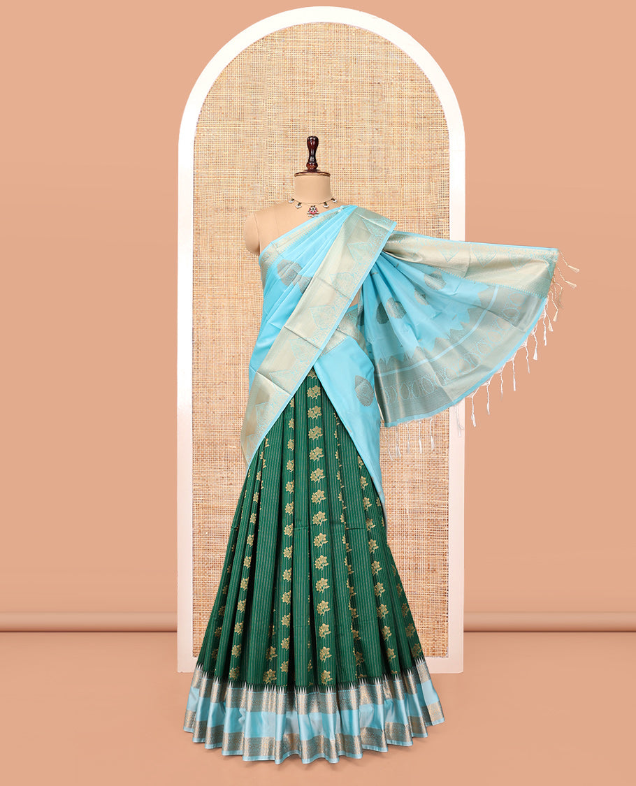 Green Art Silk Half-Saree Pavadai Material Features a Zari-Buttas Skirt, a Contrast Traditional Border, Contrast Blouse, and Intricate Dhavani