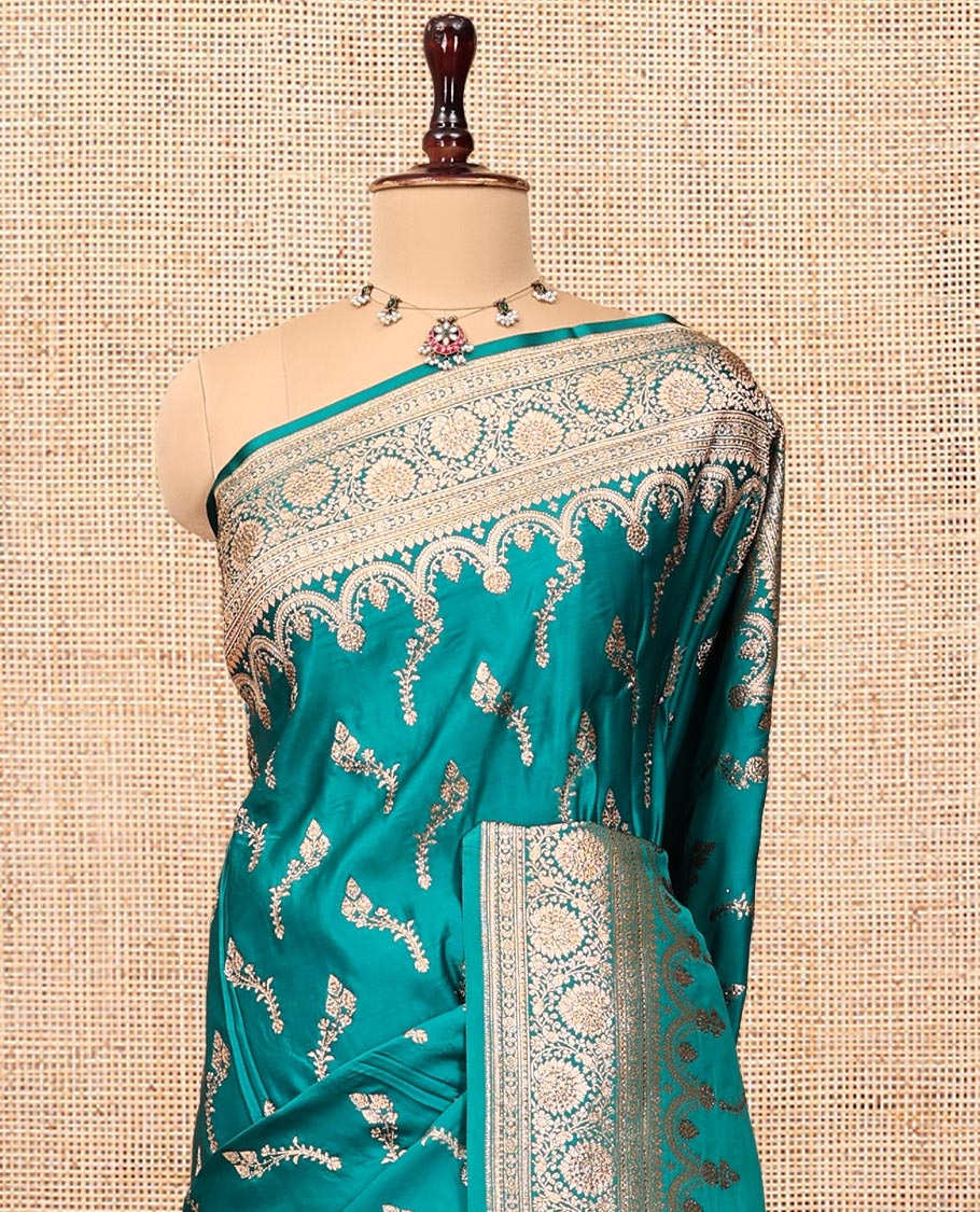Blue Banarasi Satin Saree, Detailed with Floral Buttas, a Floral Creeper Border, Intricate Stonework Pallu, and a Matching Blouse