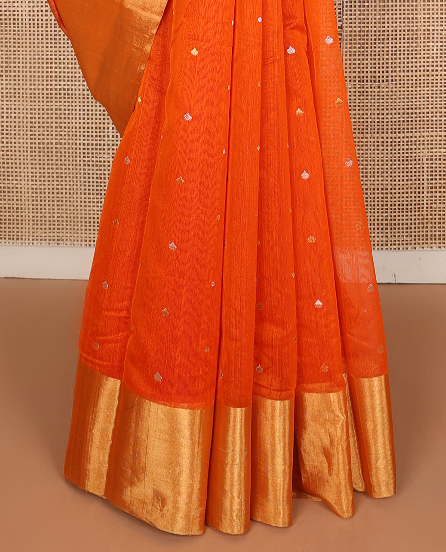 Orange buttas silk saree, bavanji border, and contrast floral zari woven pallu
