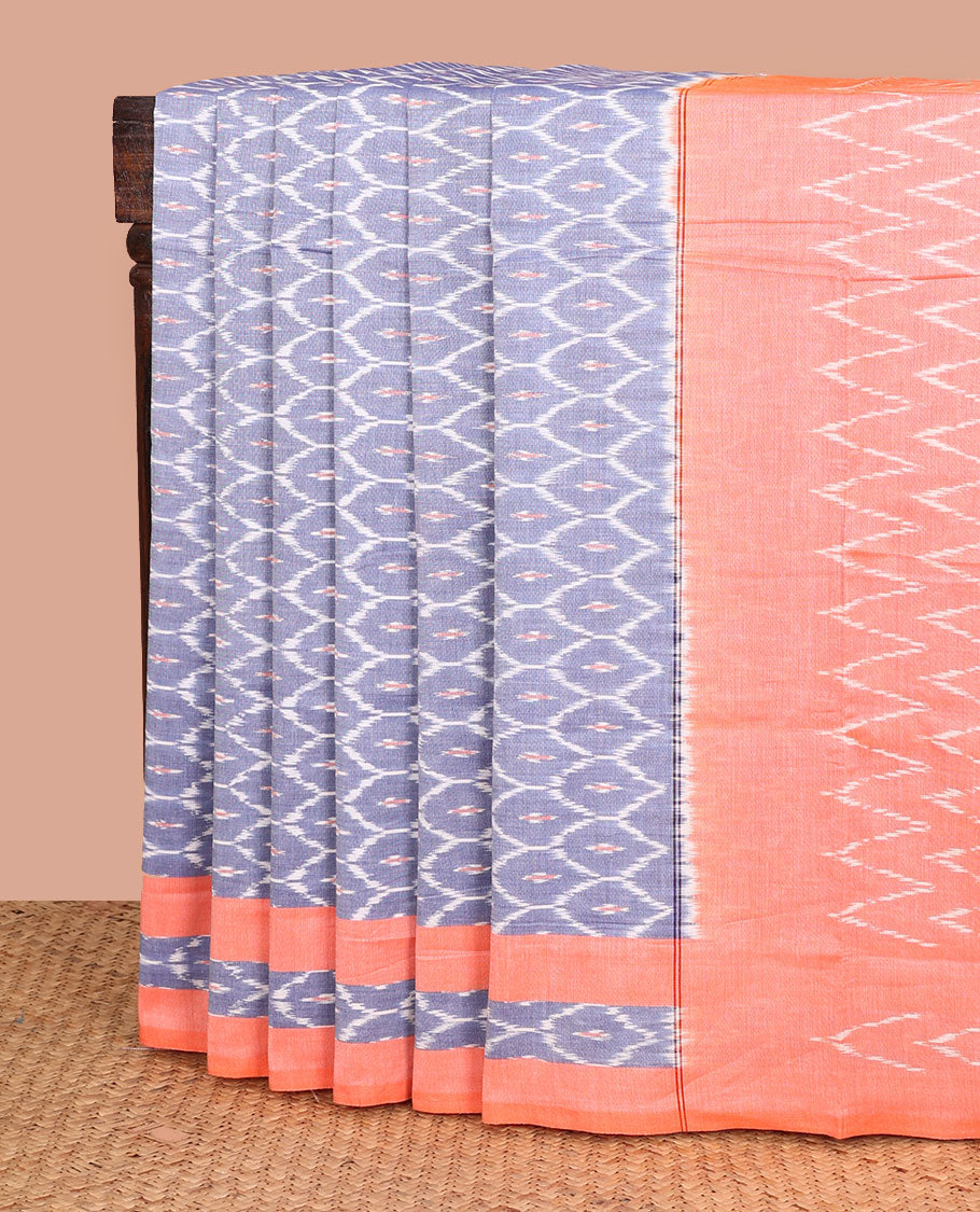 Blue ogee patterned ikkat cotton saree, contrast ikkat woven border, and chevron striped pallu