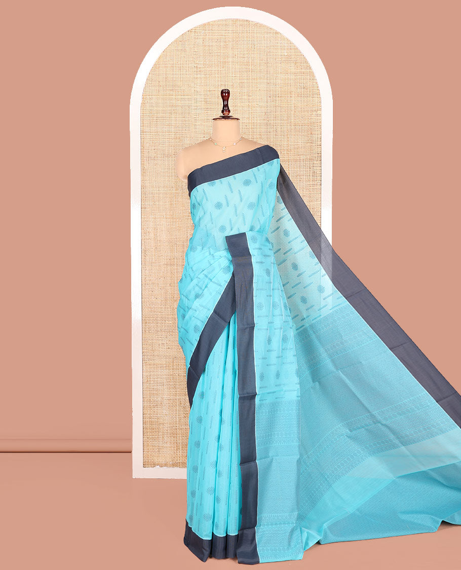 Blue Semi-Silk Cotton Saree, Subtly Adorned with Buttas on Its Body, Complemented by Contrast Border, Sparsely Designed Pallu of Geometric Designs, and Paired with a Matching Blouse