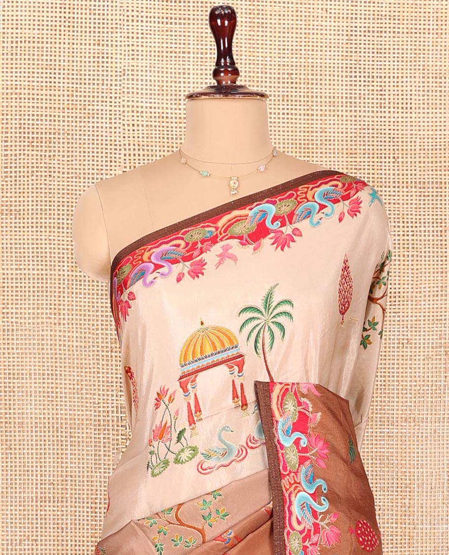 Pale Brown Dola Silk Saree, Richly Detailed with Mughal-Style Design on Its Body, Complemented by Contrast Floral-Bird Printed Border, Mughal-Style Printed Pallu, and Paired with a Contrast Blouse