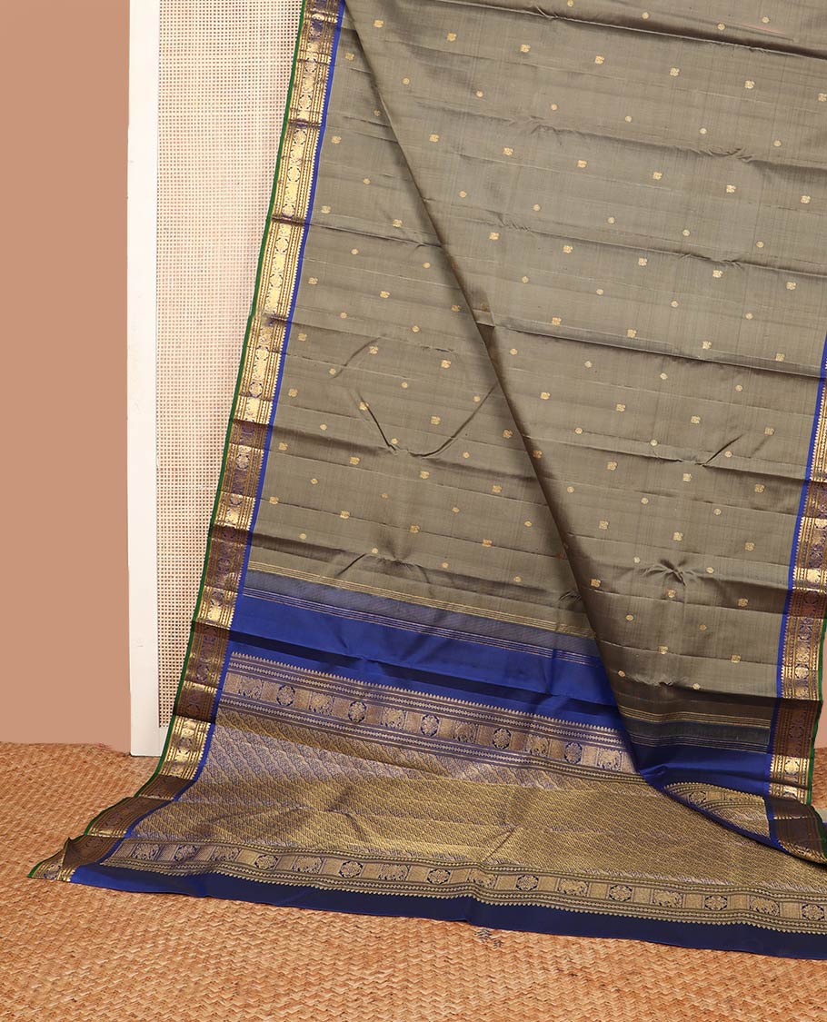 Grey mayil chakram buttas silk saree, contrast border of thilakam mokku,banaras,neli,yaanai & manga & pallu of intricate designs