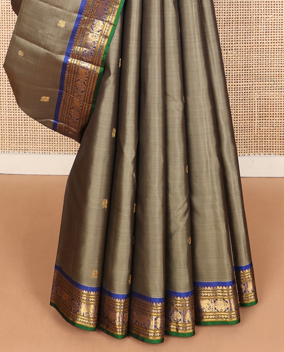 Grey mayil chakram buttas silk saree, contrast border of thilakam mokku,banaras,neli,yaanai & manga & pallu of intricate designs