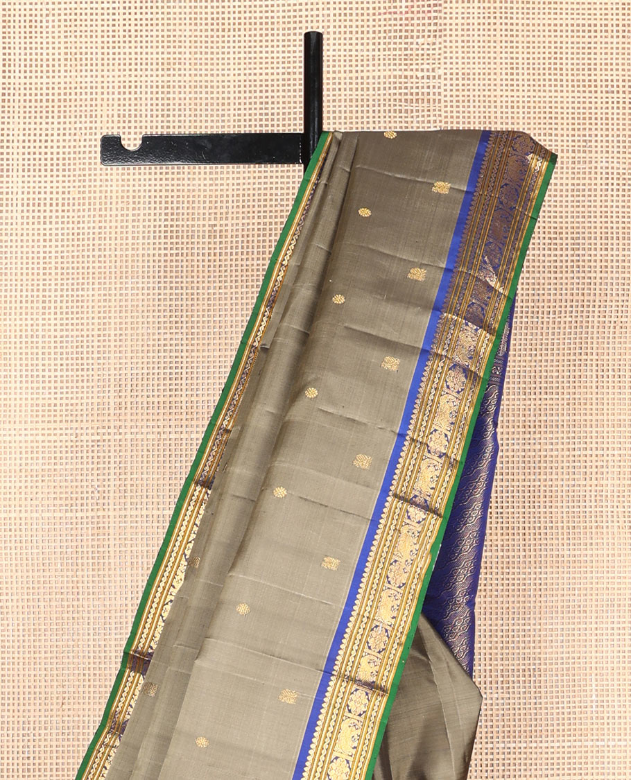 Grey mayil chakram buttas silk saree, contrast border of thilakam mokku,banaras,neli,yaanai & manga & pallu of intricate designs