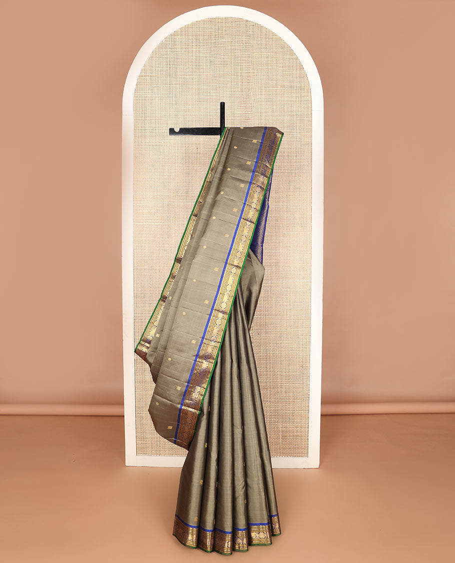 Grey mayil chakram buttas silk saree, contrast border of thilakam mokku,banaras,neli,yaanai & manga & pallu of intricate designs