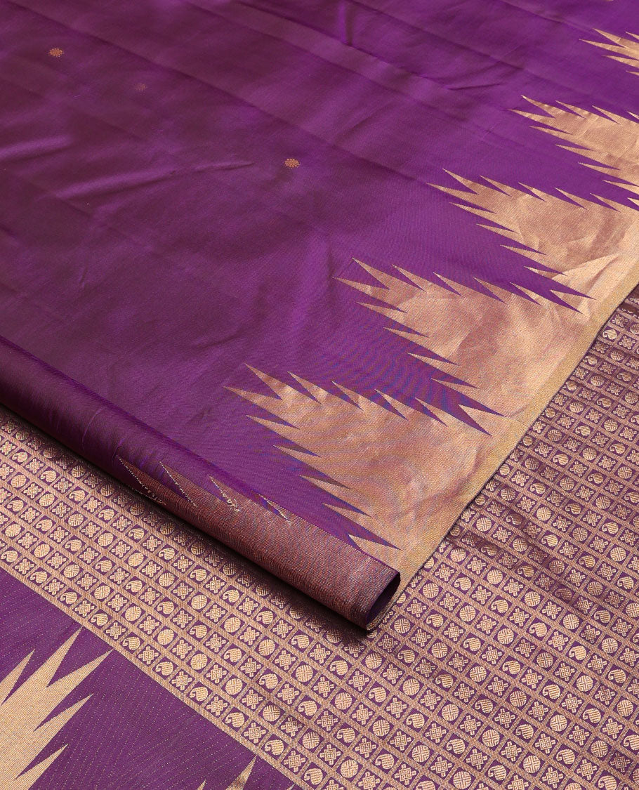 Purple zari buttas Kanchipuram silk saree, thazampoo rekku zari border, and pallu of manga, kolam, and rudraksham motifs enclosed checks