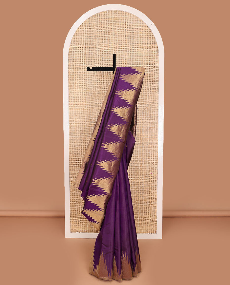 Purple zari buttas Kanchipuram silk saree, thazampoo rekku zari border, and pallu of manga, kolam, and rudraksham motifs enclosed checks