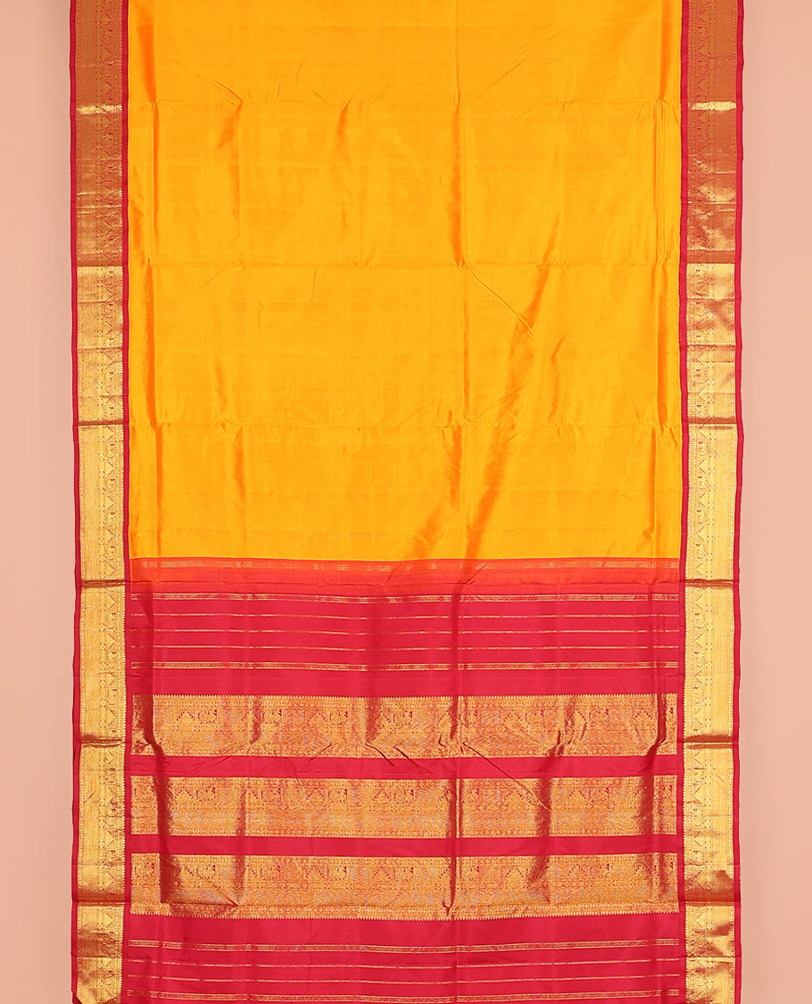 Orange plain nine-yard silk saree, contrast korvai border of thilakam mokku, Muthu, manga, mayil, rekku, and kuyil kann designs, and zari design pallu