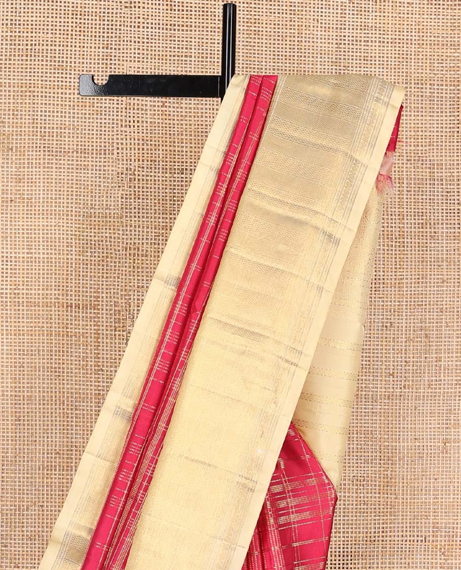 Red muthu striped silks saree, contrast border of manga mokku, muthu, poun, and mayli kann designs, and zari design pallu