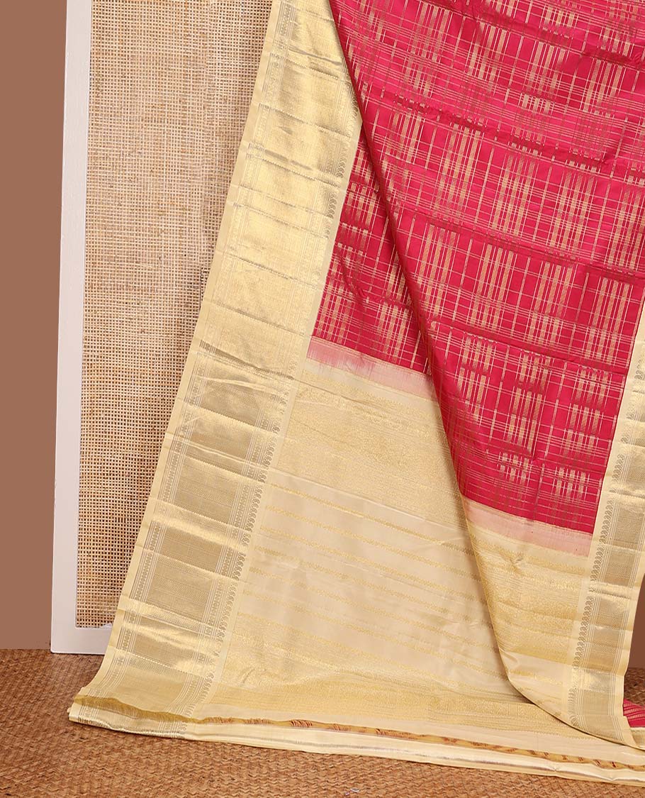 Red muthu striped silks saree, contrast border of manga mokku, muthu, poun, and mayli kann designs, and zari design pallu
