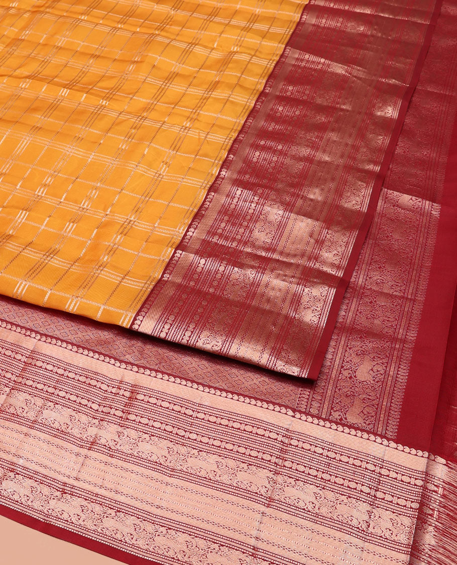 Orange Vasundhara Silk Saree Elevated with Zari Checks All Over Its Body, Complemented by a Contrast Border of Manga, Rudraksham, Yaali, Neli, and Muthu Designs, Zari Rich Jaal Pallu, and Paired with a Contrast Blouse