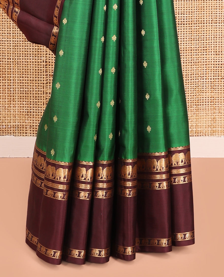Green Vasundhara Silk Saree, Elevated with Zari Buttas All Over Its Body, Complemented by a Contrast Rettai Pettu Border of Yaanai Designs, Grand Jaal Pallu, and Paired with a Contrast Blouse