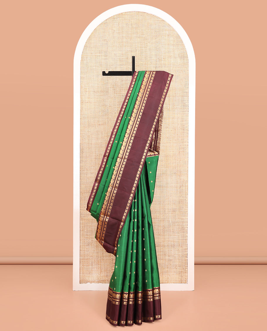 Green Vasundhara Silk Saree, Elevated with Zari Buttas All Over Its Body, Complemented by a Contrast Rettai Pettu Border of Yaanai Designs, Grand Jaal Pallu, and Paired with a Contrast Blouse