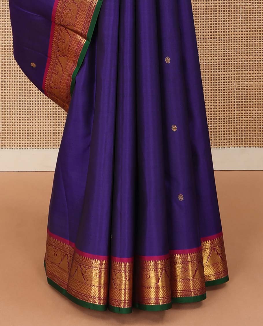 Blue buttas Kanchipuram silksaree, contrast border of rekku,muthu,mayil kann,thazampoo rekku, and mayil, and pallu of laddu kamalam, and mayil kann enclosed checks