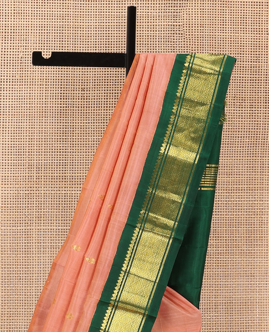 Peach zari buttas Kanchipuram silk saree, contrast one-sided korvai zari border of thilakam mokku, banaras, and jaal, and zari design pallu
