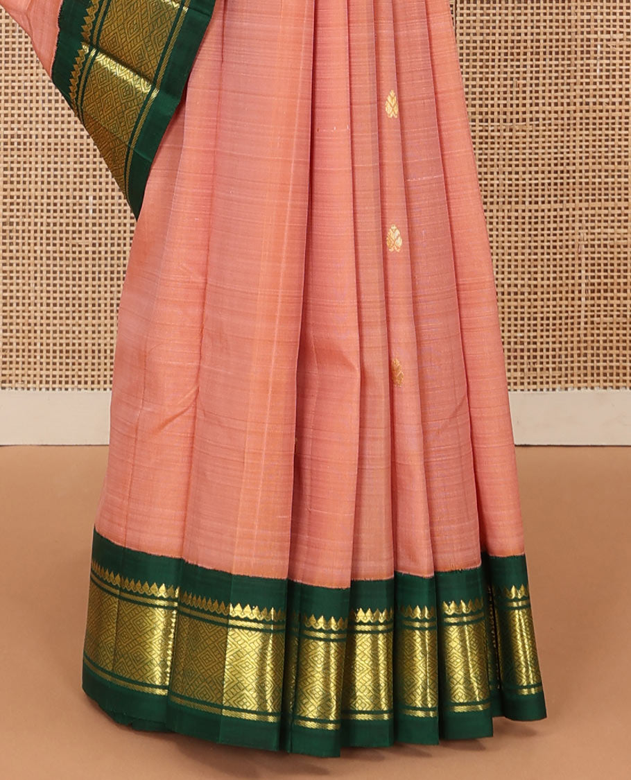 Peach zari buttas Kanchipuram silk saree, contrast one-sided korvai zari border of thilakam mokku, banaras, and jaal, and zari design pallu