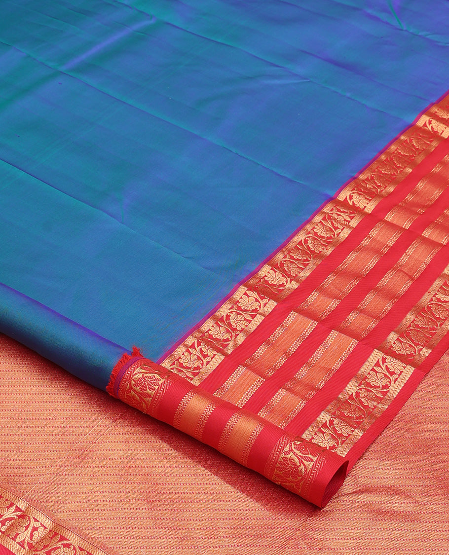 Blue plain Kanchipuram silk saree, contrast border of muthu, neli, and kodi visiry designs, and diagonally woven pallu