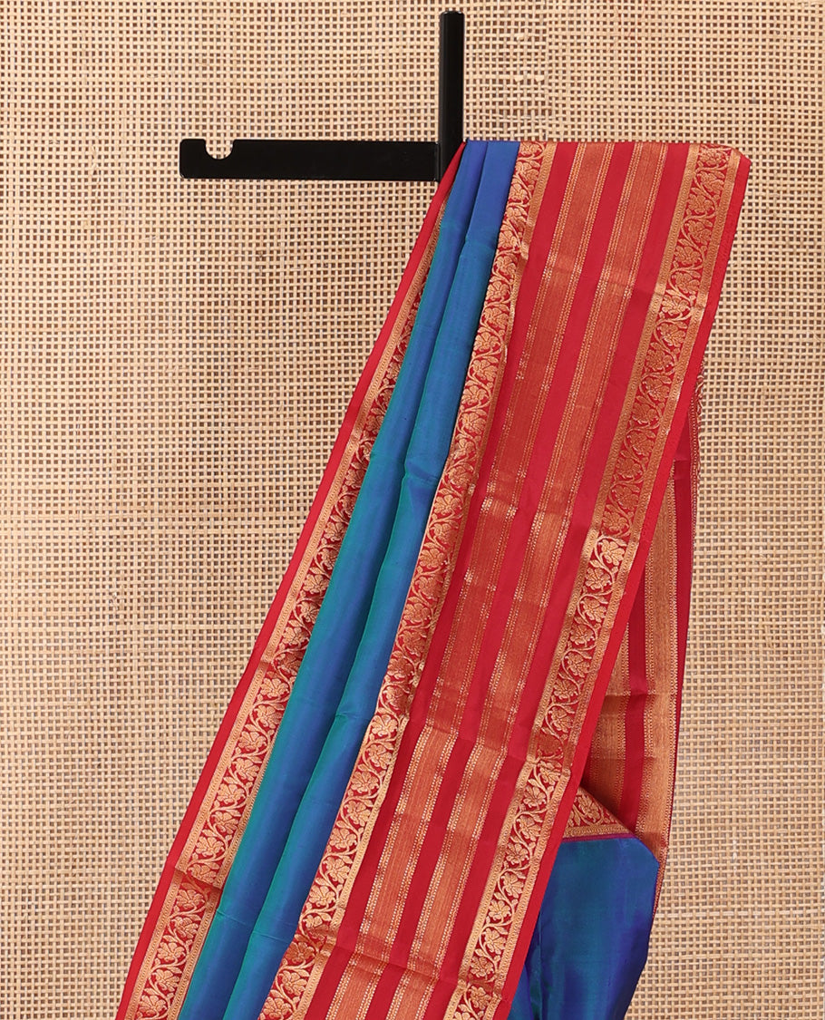 Blue plain Kanchipuram silk saree, contrast border of muthu, neli, and kodi visiry designs, and diagonally woven pallu