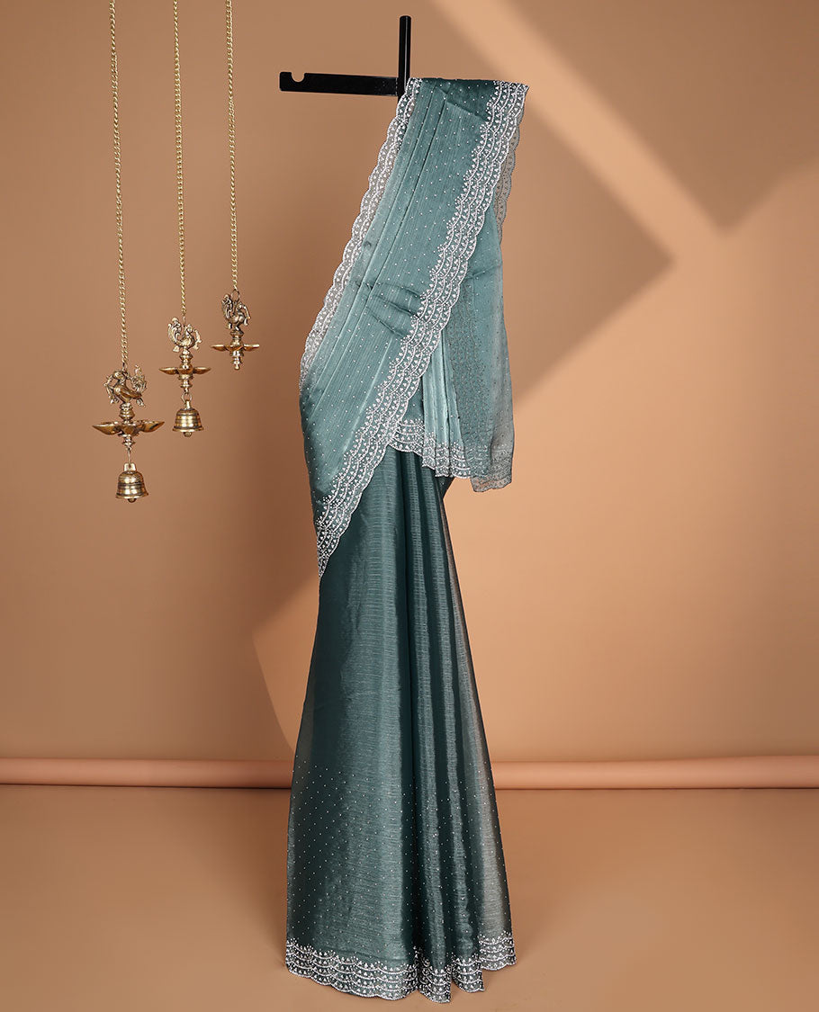 Blue all-over stone work burburry chiffion saree with self cutthana stone work border