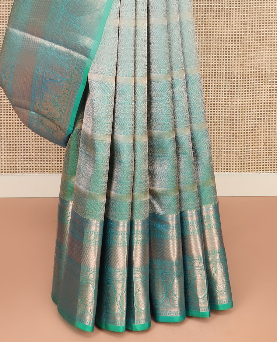 Green Kanchipuram Wedding Silk Saree Decorated with Jacquard Designs, Highlighted with a Zari Border of Rekku, Muthu, Rudraksham, Mayil Kann, and Dhavani Kodi Designs, Artfully Detailed Pallu, and Paired with a Matching Blouse