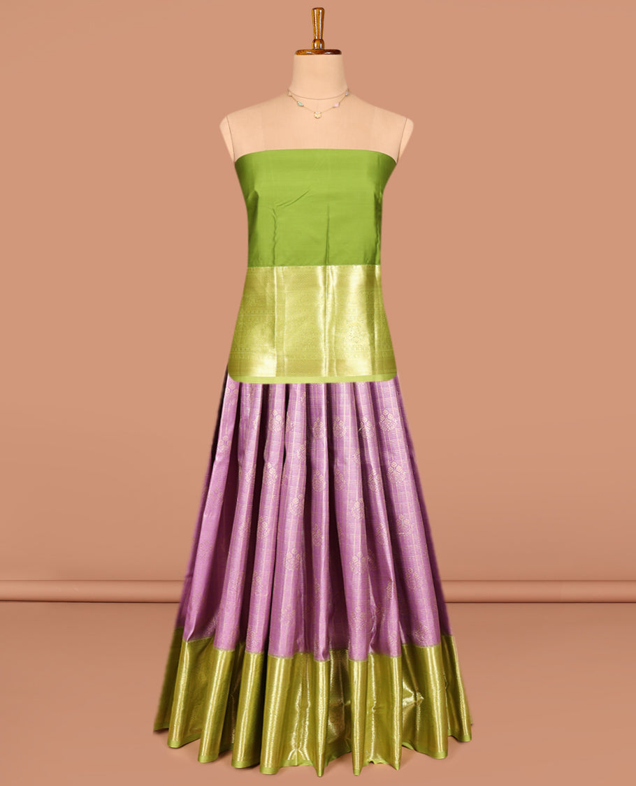 Pink Art Silk Pavadai Material Set, Showcasing Zari Buttas and Checks on Its Skirt, Complemented by a Contrast Traditional Zari Design Border, and Paired with a Contrast Blouse