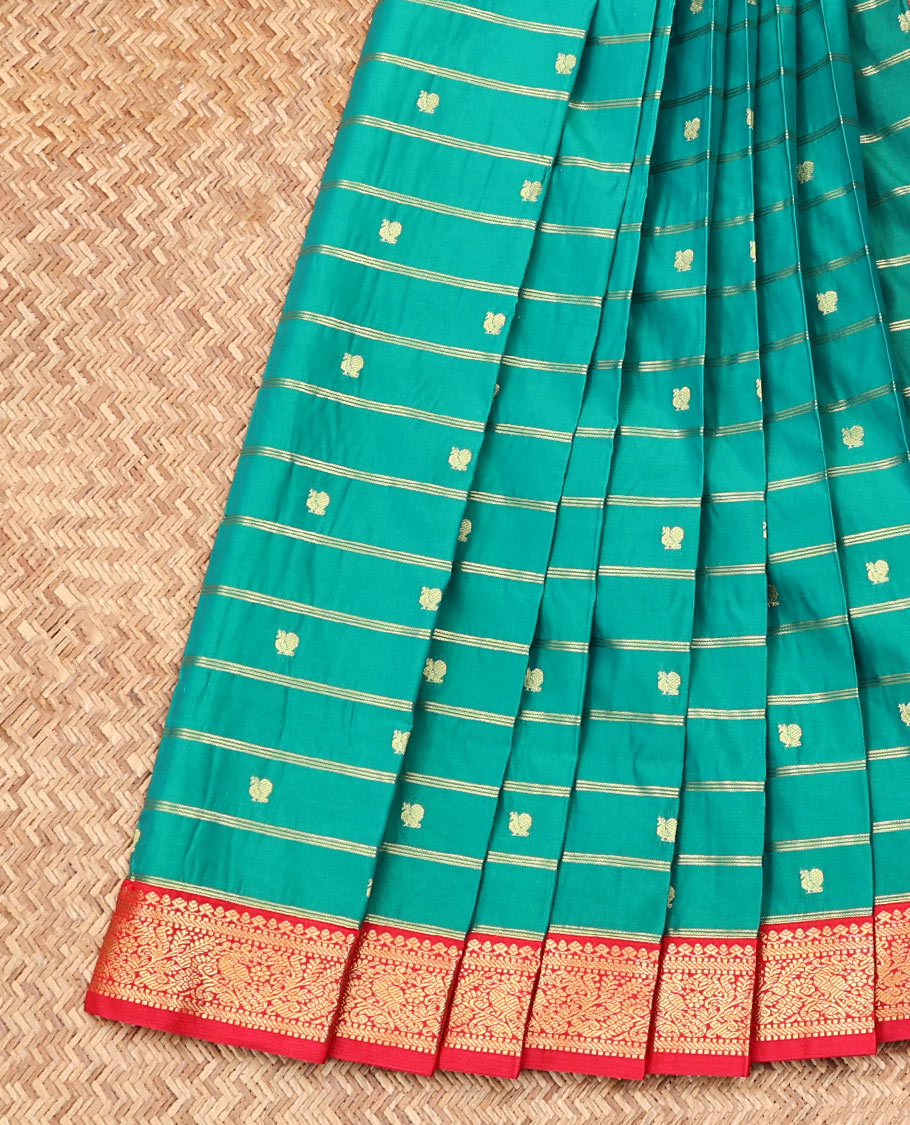 Green Budget Silk Saree, Enriched with Peacock Zari Buttas and Stripes on Its Body, Complemented by a Contrast Traditional Zari Rettai Pettu Border, Grand Jaal Pallu, and Paired with a Contrast Blouse