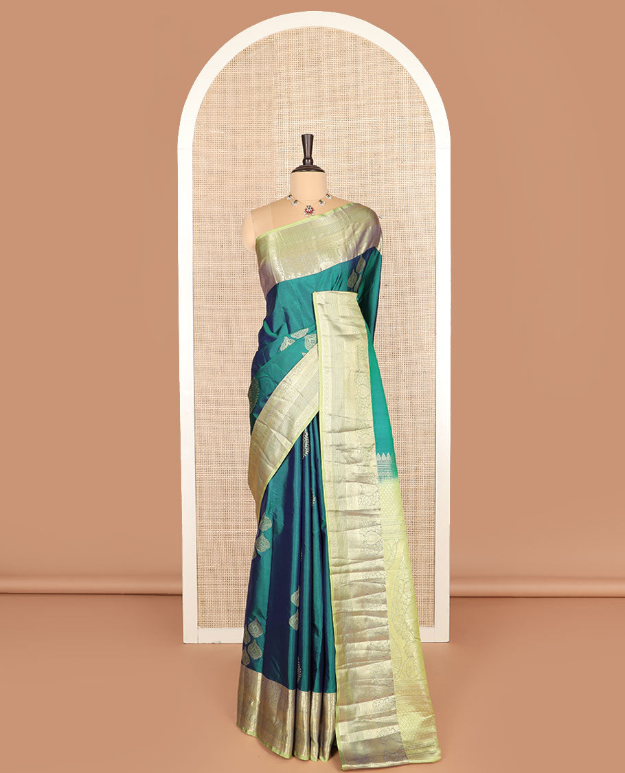 Green thilakam buttas budget silk saree, contrast traditional zari motifs border, and intricately designed pallu