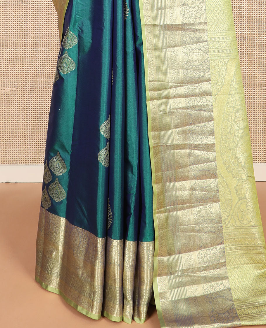 Green thilakam buttas budget silk saree, contrast traditional zari motifs border, and intricately designed pallu