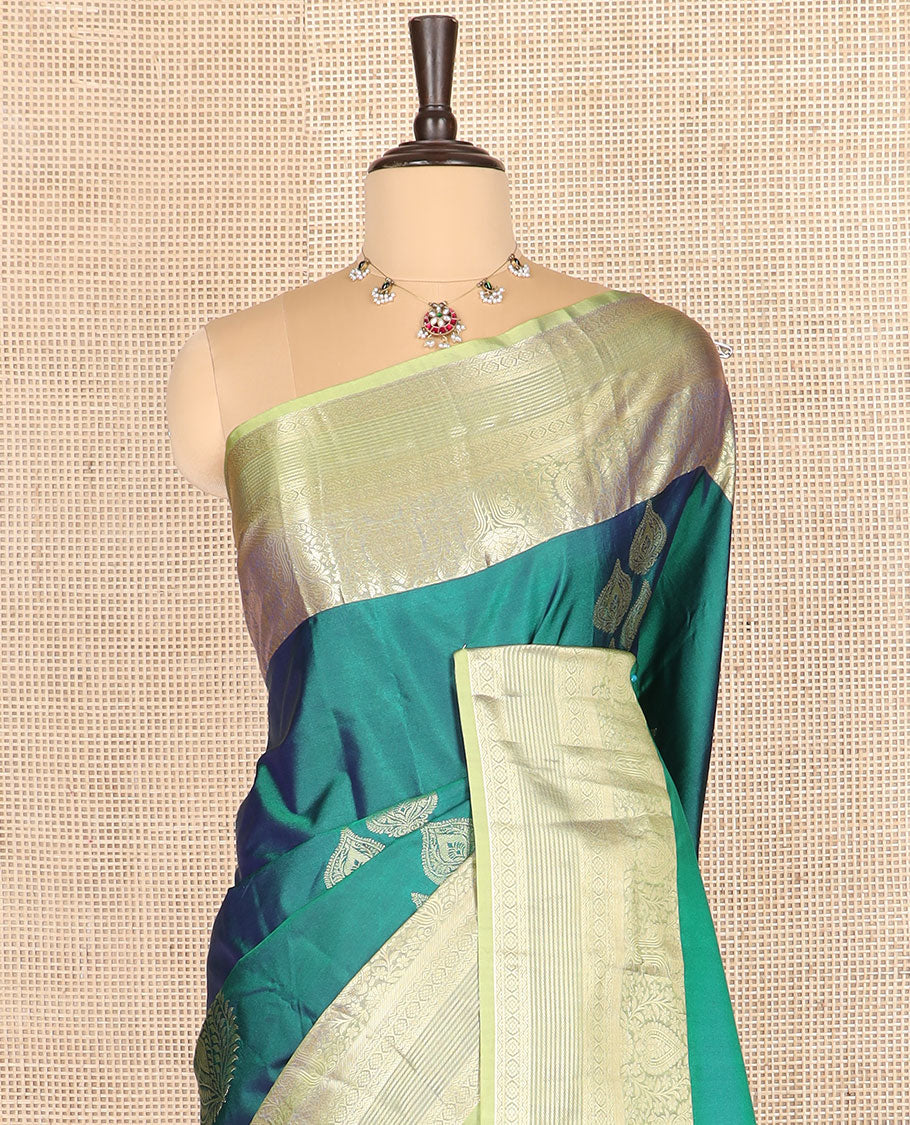 Green thilakam buttas budget silk saree, contrast traditional zari motifs border, and intricately designed pallu