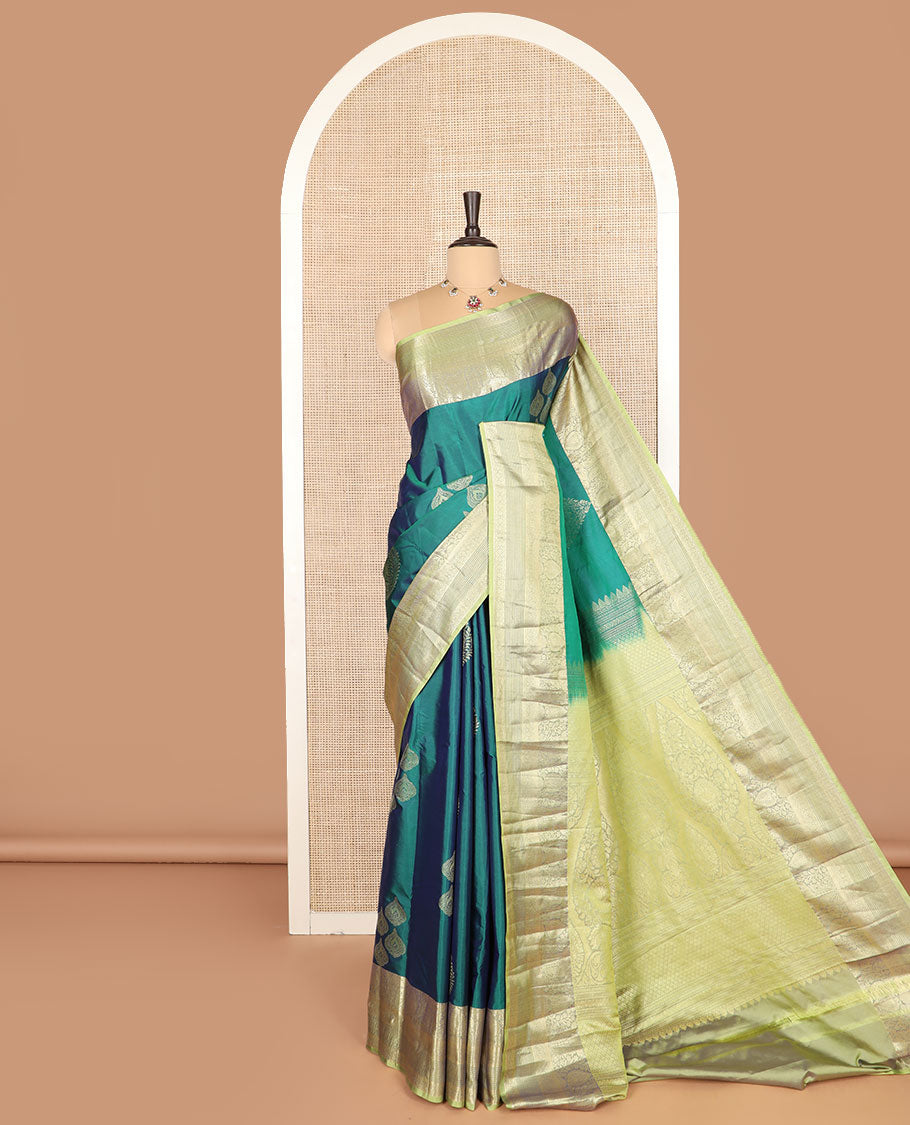 Green thilakam buttas budget silk saree, contrast traditional zari motifs border, and intricately designed pallu