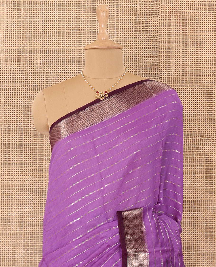 Lavender horizontal striped Assam silk saree, traditional zari border, and zari-rich gleaming pallu