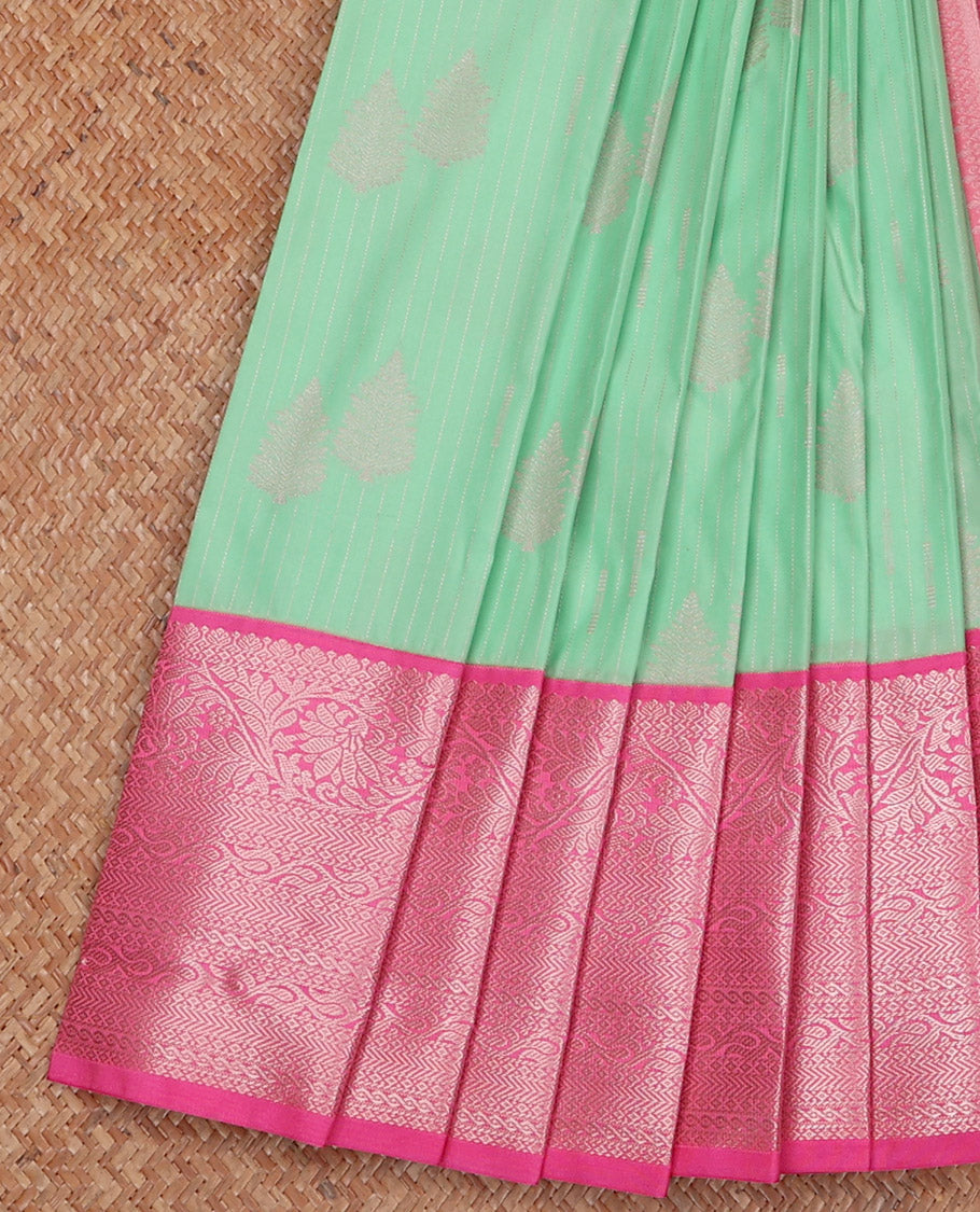Green Budget Silk Saree Sparsely Sparkled with Tree Buttas and Stripes All Over Its Body, Complemented by a Contrast Border of Traditional Zari Designs, Pallu Gleamed Up with Jaal Designs, and Paired with a Contrast Blouse