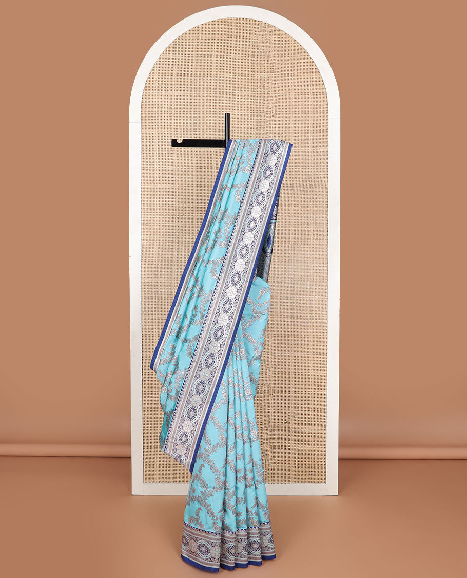 Cyan floral jaal design butter silk saree with contrast intricate zari design border & floral design pallu