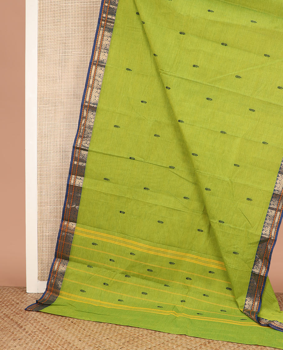 Leaf green buttas Chettinad cotton saree, contrast traditional design border, and striped pallu