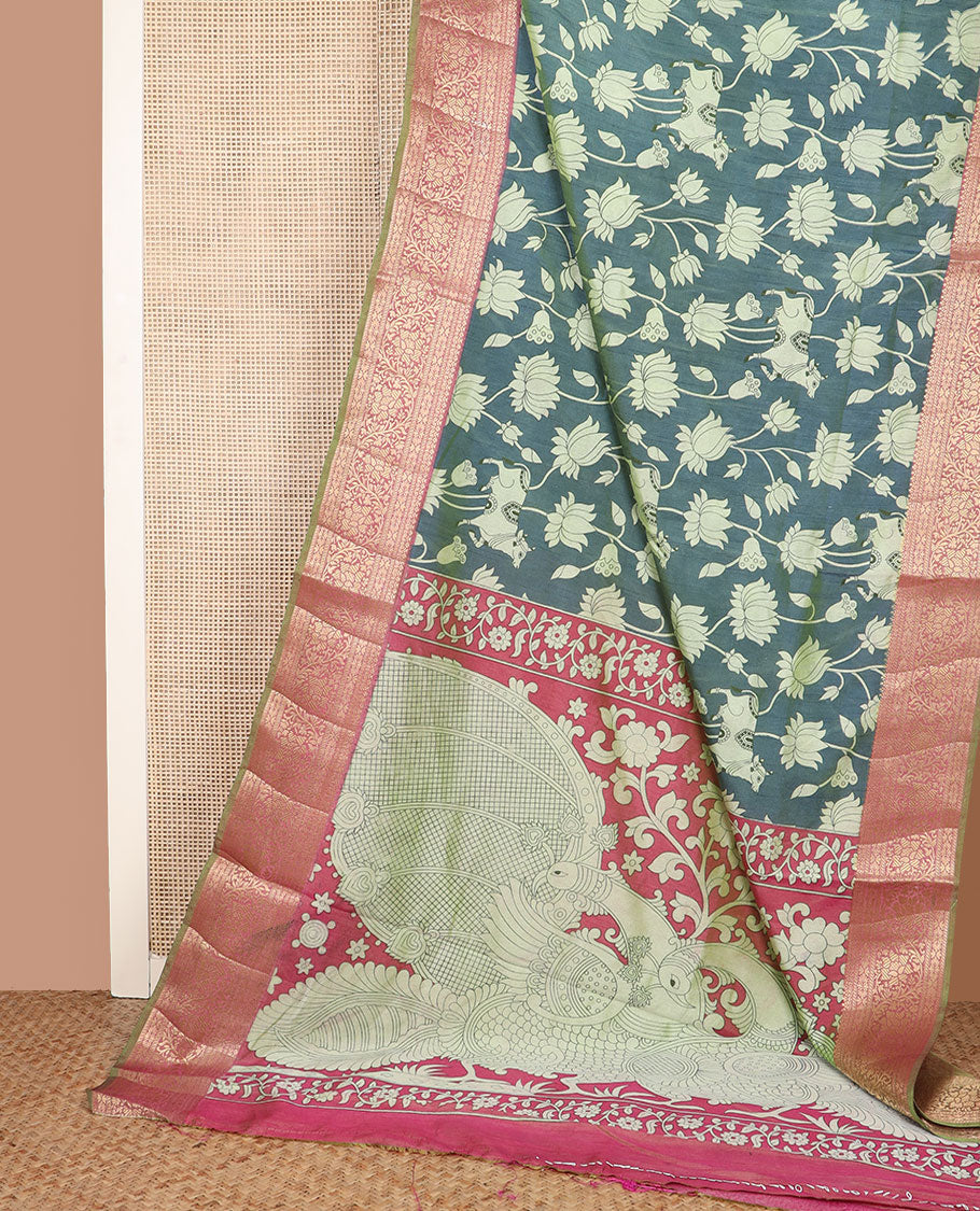 Blue Lotus vine and Pichwai cow printed semi-banaras patola silk saree, contrast floral creeper zari border, and pallu of big peacock motifs