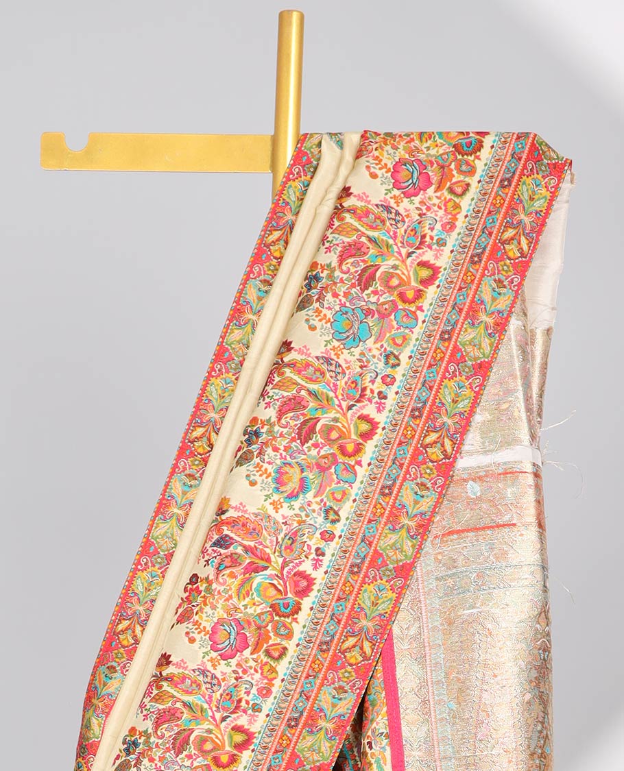 Cream semi-banaras dola silk saree with contrast floral motif border & paisley motifs pallu