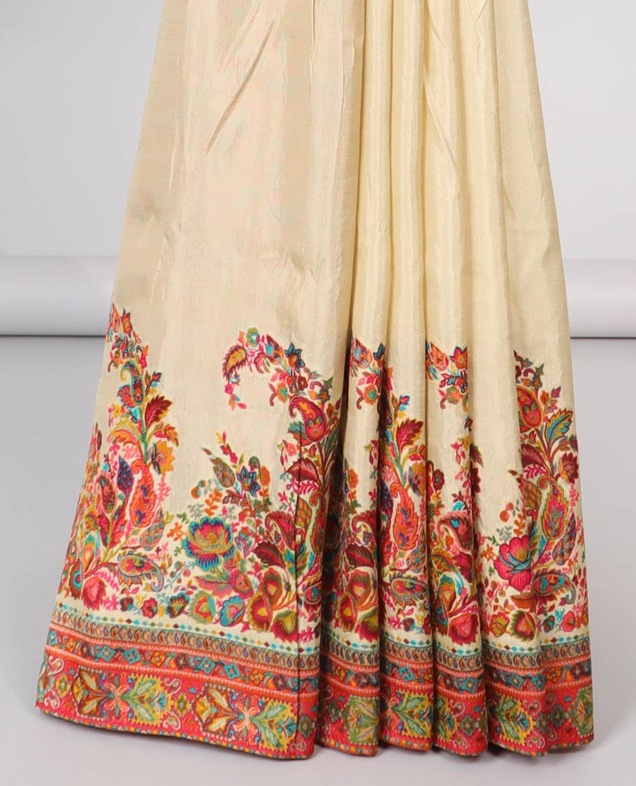 Cream semi-banaras dola silk saree with contrast floral motif border & paisley motifs pallu