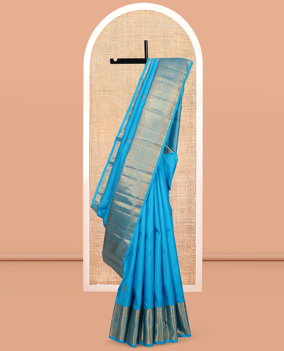 Blue Kanchipuram Silk Saree, Mesmerized with Zari Buttas, Highlighted by Zari Border of Thilakam Mokku, Kathir, Mayil, Chakram, and Yaali, Grand Pallu, and Matching Blouse