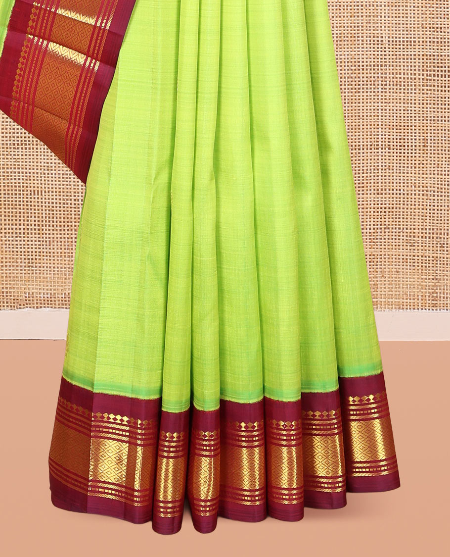 Green Kanchipuram Silk Saree, Woven with Zari Buttas, a Contrast One-Sided Korvai Border of Panner Sombu, Banaras, Muthu, and Mayil Kann Designs, Zari Design Pallu, and a No Blouse