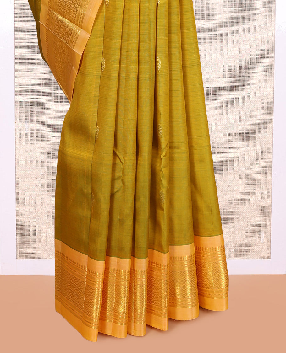 Green Kanchipuram Silk Saree, Accentuated with Zari Buttas, a Contrast One-sided Border of Panner Sombu, Banaras, Muthu, and Jaal Designs, Pallu of Zari Designs, and No Blouse