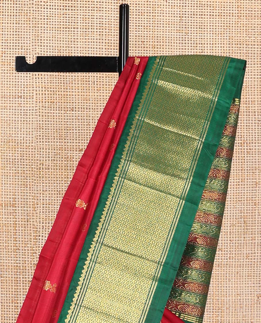 Red buttas kancheepuram silk saree with contrast korvai border of banaras, thilakam mokku, kuyil kann design & floral design pallu