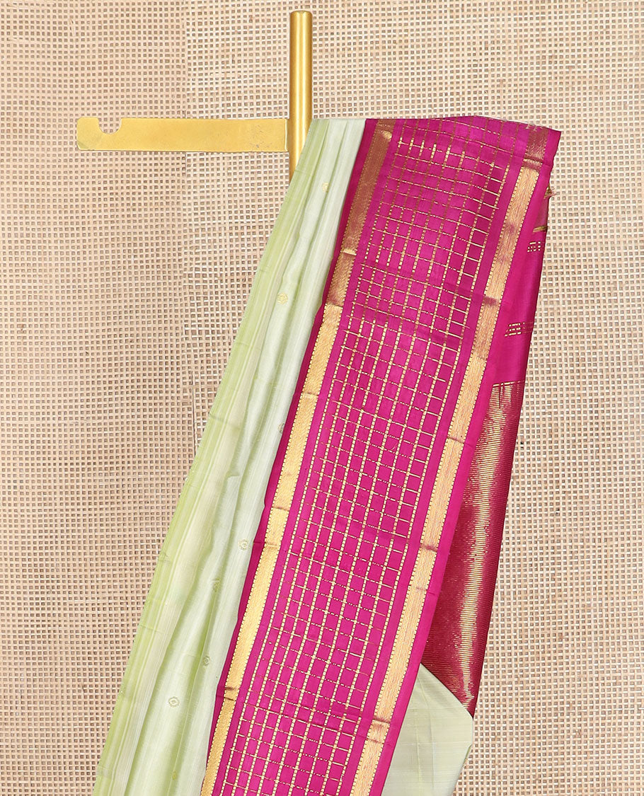 Pale green zari buttas kanchipuram silk saree, contrast one-sided thazampoo rekku muthu kattam border & pallu of zari stripes & thazampoo rekku