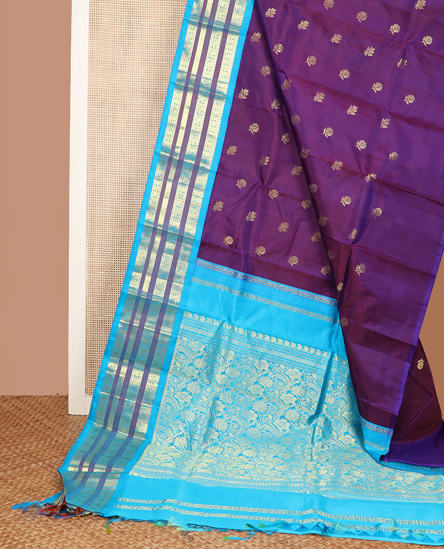 Purple zari buttas Kanchipuram silk saree, contrast one-sided korvai border of thilakam mokku, mayil, and rudraksham designs, and floral design pallu
