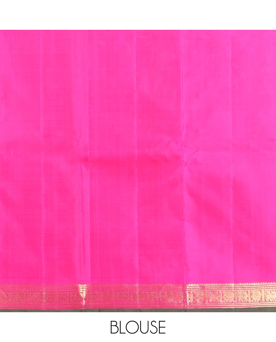 Orange zari buttas Kanchipuram silk saree, contrast border of thilakam mokku, maan, and mayil designs, and intricate pallu