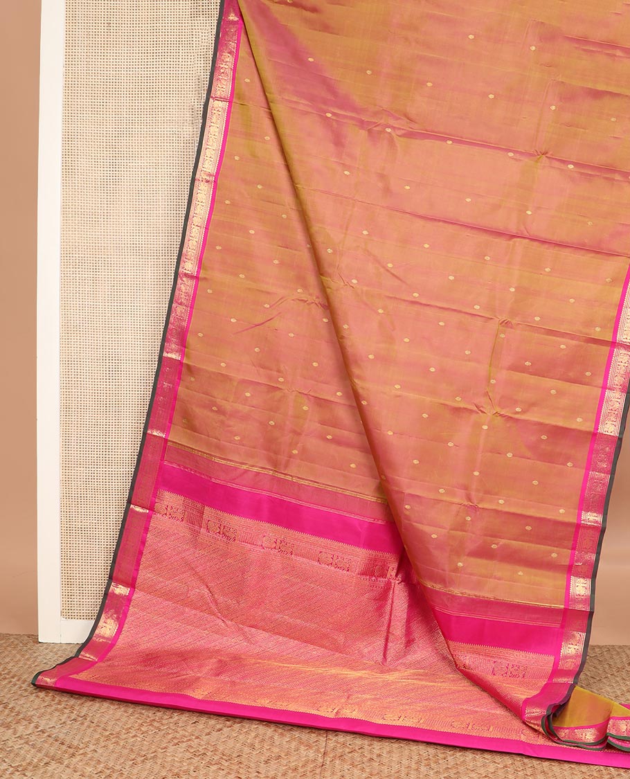 Orange zari buttas Kanchipuram silk saree, contrast border of thilakam mokku, maan, and mayil designs, and intricate pallu