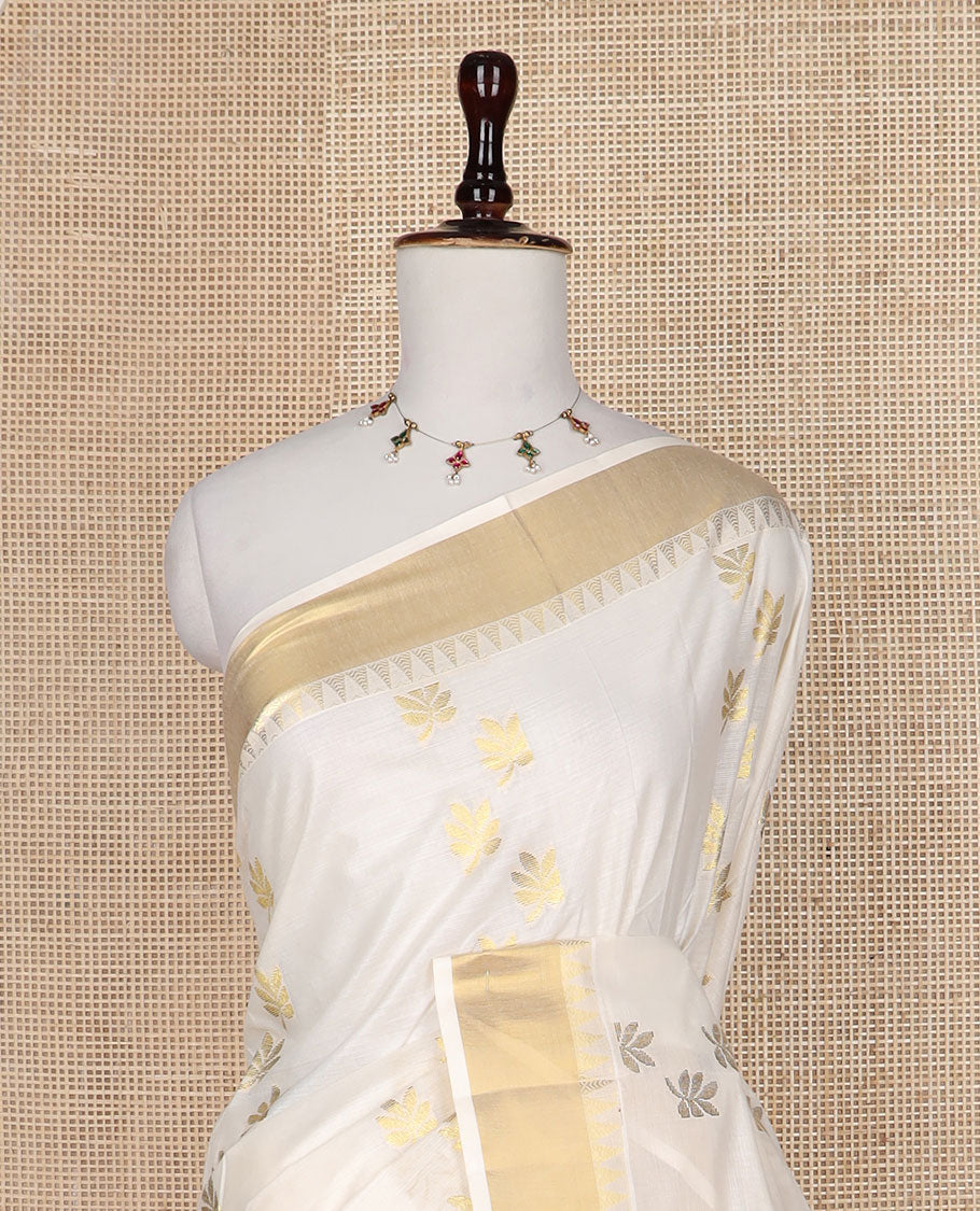 Cream leaf buttas Kerala saree, zari temple border, and pallu of leaf designs